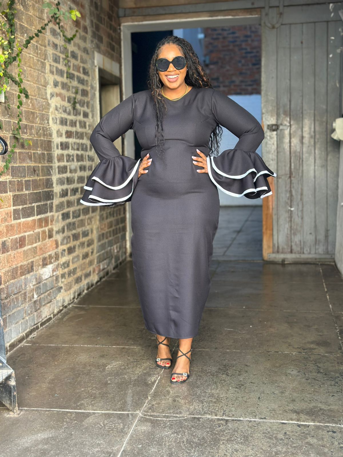 Black dress with tiered sleeves